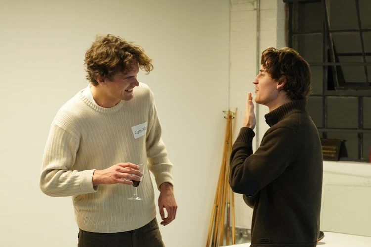 Two members talking at a community event