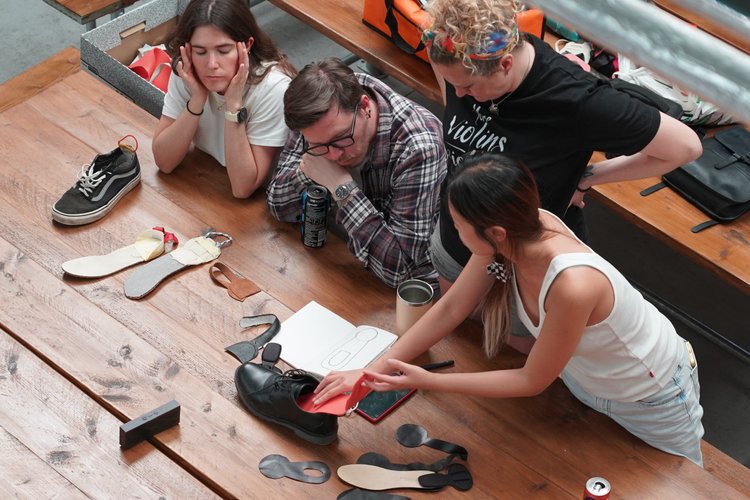 Blue Garage members collaborating around a shared worktable