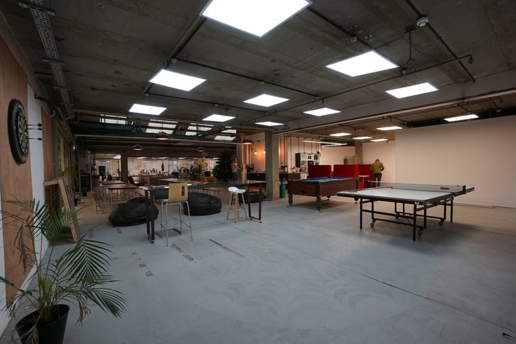Recreation area with table tennis, table football and lounge seating.